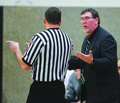 Joel Wisz talks to Rock Falls coach Brad Bickett during a regional semi-final game